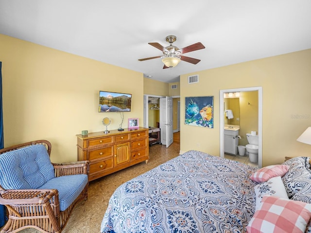 bedroom featuring ceiling fan, connected bathroom, a spacious closet, and a closet