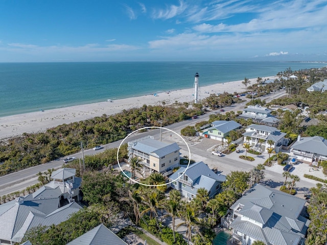 drone / aerial view with a view of the beach and a water view