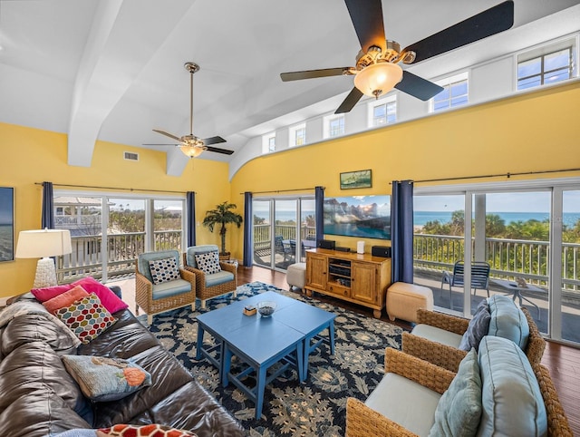 living room with hardwood / wood-style floors, vaulted ceiling, and ceiling fan