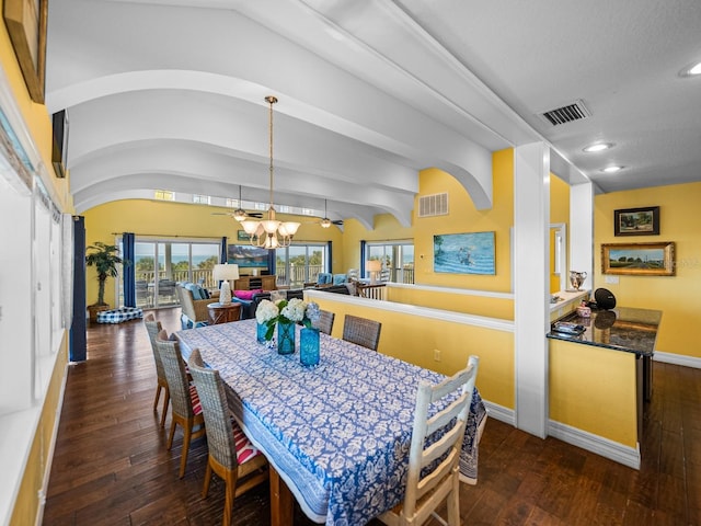 dining area with lofted ceiling, dark hardwood / wood-style floors, and ceiling fan