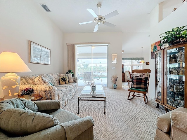 carpeted living room featuring ceiling fan