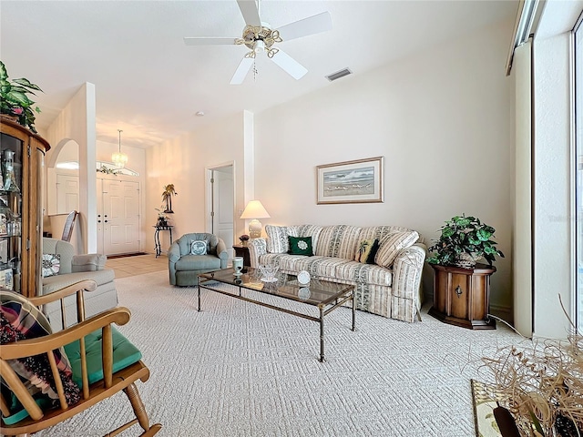 living room featuring ceiling fan and light colored carpet