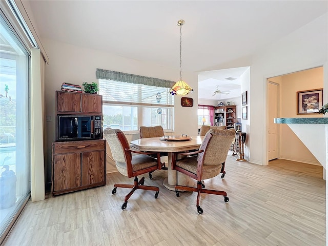 dining area with light hardwood / wood-style flooring