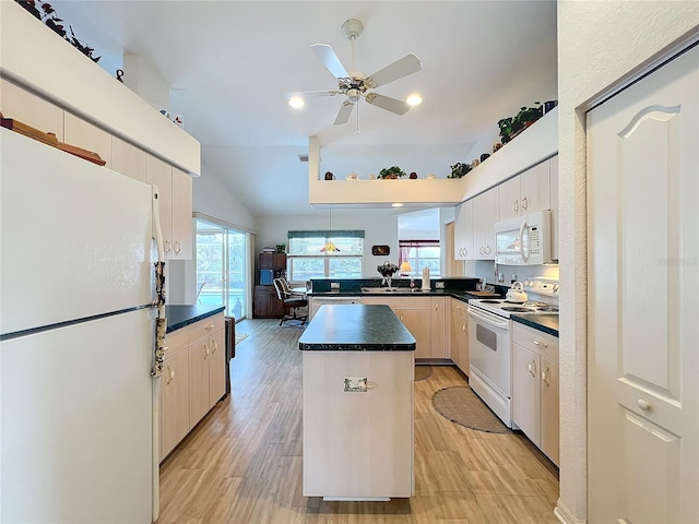 kitchen with dark countertops, ceiling fan, light wood-style flooring, a peninsula, and white appliances