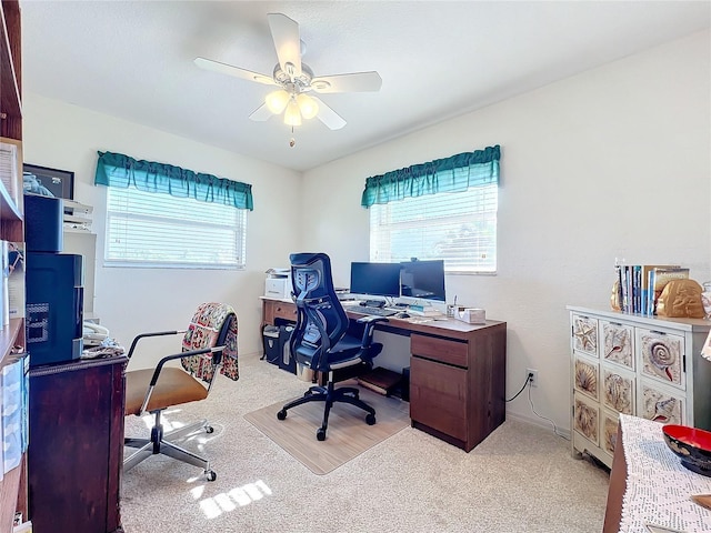 office featuring ceiling fan and light carpet