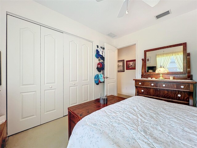 bedroom featuring visible vents, a closet, and ceiling fan