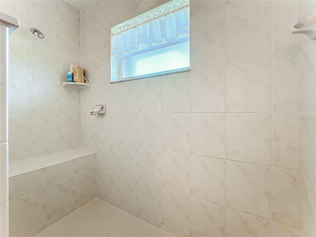 bathroom featuring tiled shower