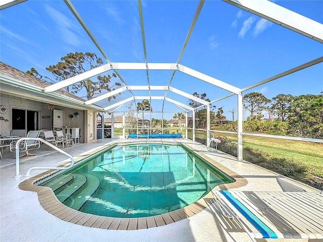 view of pool featuring a lanai and a patio