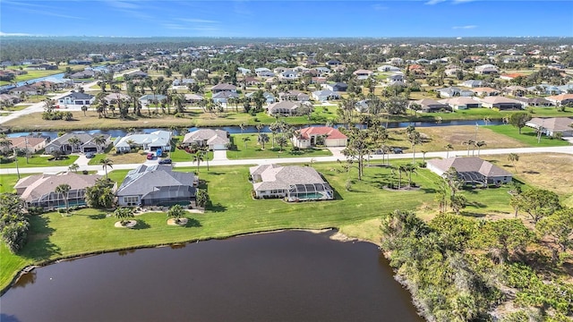 birds eye view of property featuring a residential view and a water view