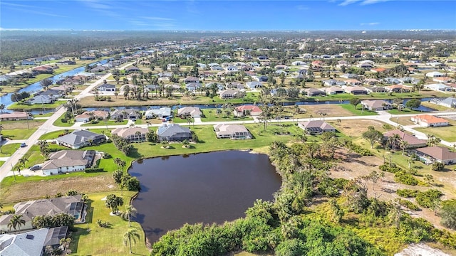 birds eye view of property featuring a residential view and a water view