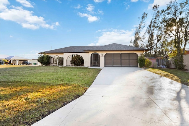 view of front facade with a garage and a front lawn