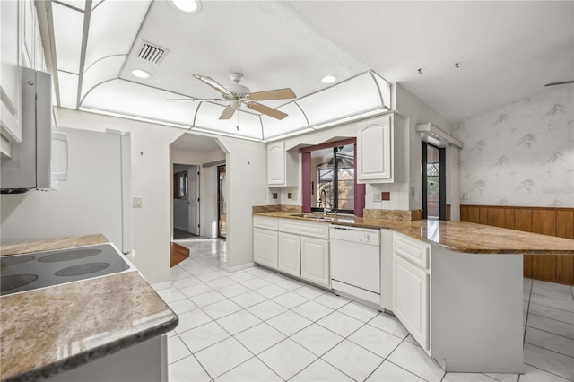 kitchen featuring white cabinetry, dishwasher, sink, ceiling fan, and kitchen peninsula