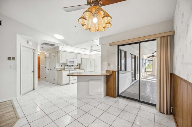 kitchen featuring white cabinetry, white appliances, kitchen peninsula, and ceiling fan