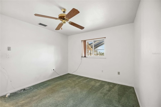 empty room featuring carpet floors and ceiling fan