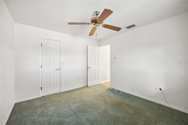 unfurnished bedroom featuring carpet floors and ceiling fan