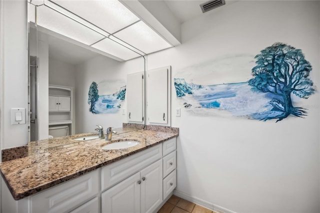 bathroom featuring vanity and tile patterned flooring