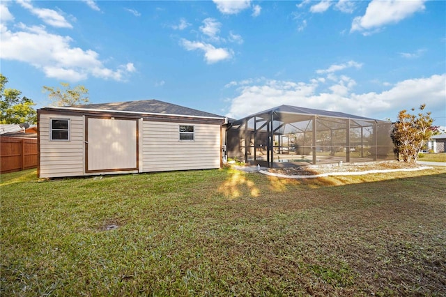 exterior space with a lanai and a shed