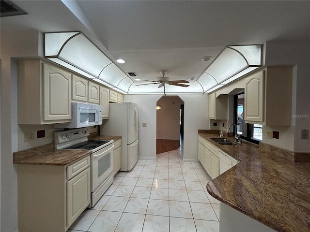 4204 Cockrell St, Port Charlotte, FL 33948 - kitchen featuring dark countertops, a ceiling fan, a sink, white appliances, and visible vents