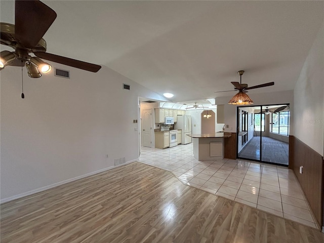 4204 Cockrell St, Port Charlotte, FL 33948 - unfurnished living room featuring light wood finished floors, a ceiling fan, and visible vents