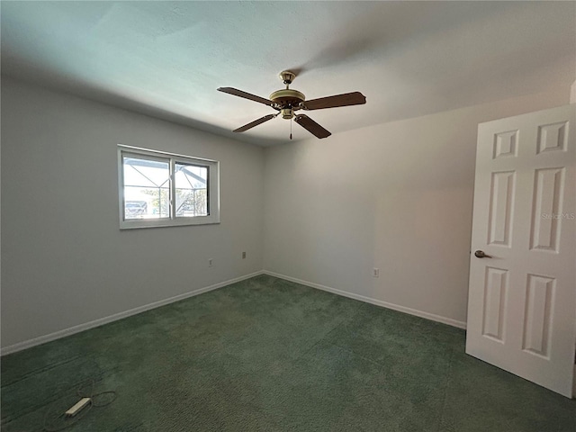 4204 Cockrell St, Port Charlotte, FL 33948 - spare room featuring dark colored carpet, baseboards, and ceiling fan