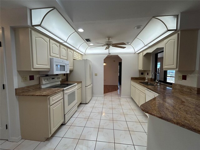 4204 Cockrell St, Port Charlotte, FL 33948 - kitchen featuring dark countertops, white appliances, a sink, and ceiling fan