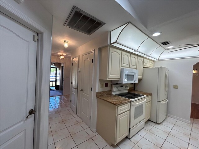 4204 Cockrell St, Port Charlotte, FL 33948 - kitchen with visible vents, dark countertops, baseboards, and white appliances