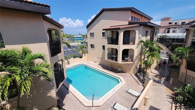 view of swimming pool featuring a patio