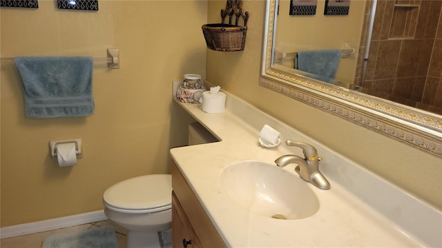 bathroom featuring toilet, tile patterned floors, and vanity