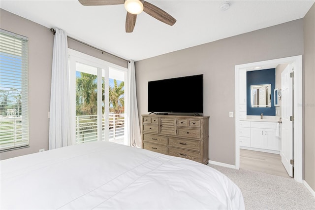 carpeted bedroom with ceiling fan, access to exterior, connected bathroom, and sink