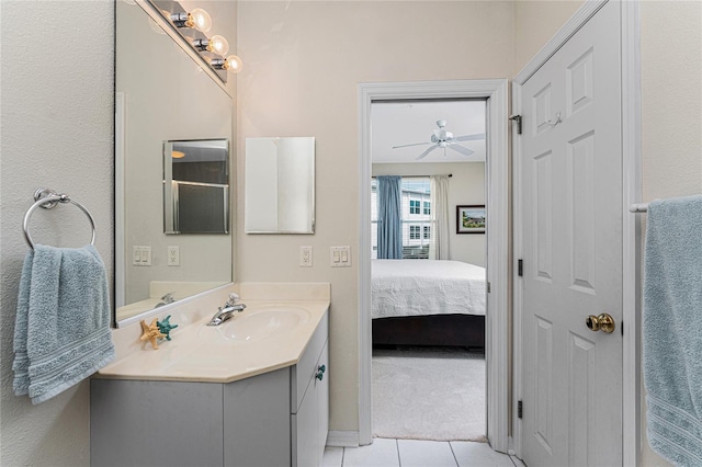 bathroom with ceiling fan, tile patterned floors, and vanity