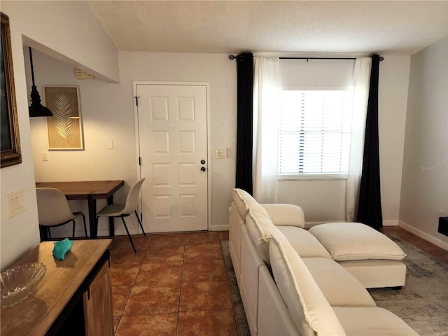 living room featuring dark tile patterned flooring