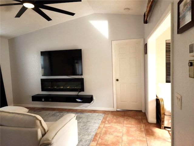 tiled living room with ceiling fan and vaulted ceiling