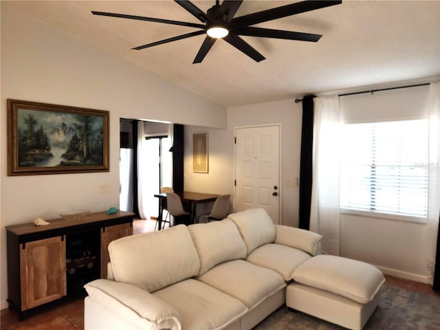 living room with ceiling fan and lofted ceiling