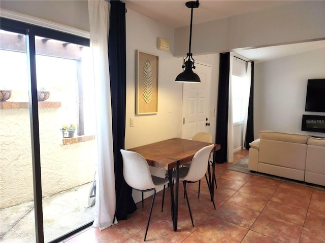 tiled dining room featuring plenty of natural light