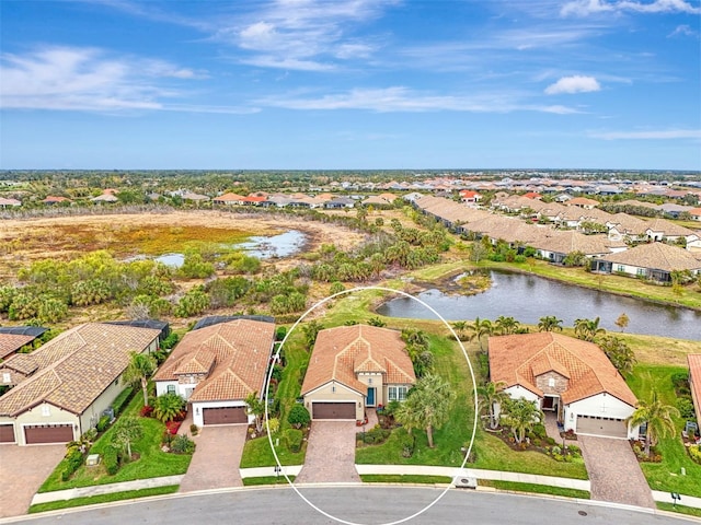 bird's eye view with a water view