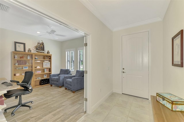 office space with ceiling fan, ornamental molding, and light hardwood / wood-style floors