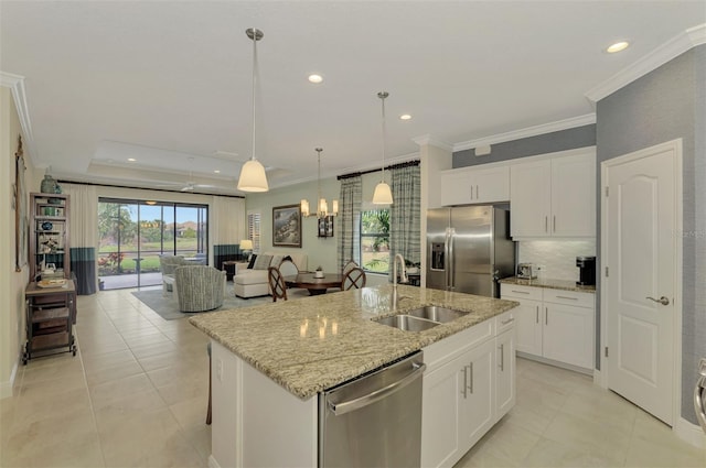 kitchen with sink, white cabinetry, a kitchen island with sink, light stone countertops, and appliances with stainless steel finishes