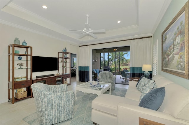 tiled living room featuring ceiling fan, crown molding, and a raised ceiling