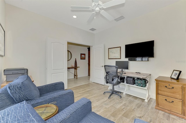 office space featuring ceiling fan and light hardwood / wood-style floors