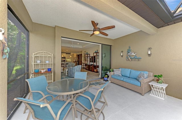 view of patio featuring ceiling fan and outdoor lounge area