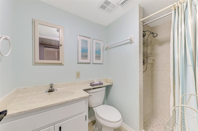 bathroom with walk in shower, vanity, toilet, and a textured ceiling