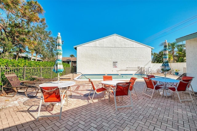 view of patio with a community pool