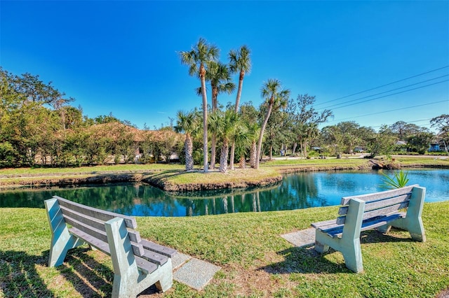 exterior space featuring a yard and a water view