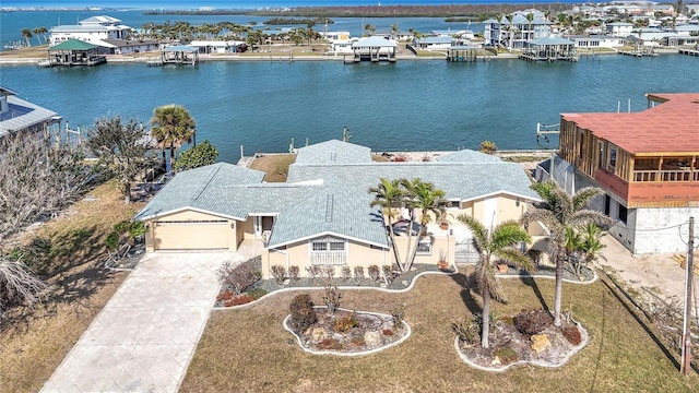 birds eye view of property featuring a water view