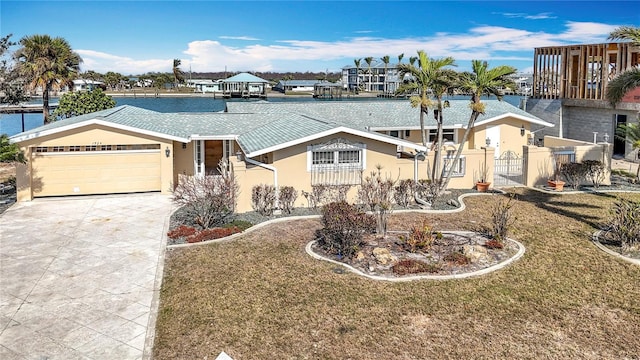 ranch-style home with a garage and a front lawn