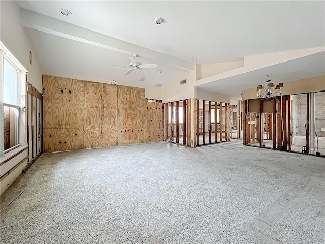 unfurnished room featuring ceiling fan with notable chandelier, wood walls, and lofted ceiling with beams