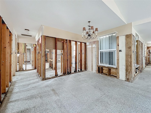 misc room with an inviting chandelier