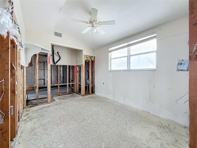 unfurnished room featuring ceiling fan and vaulted ceiling