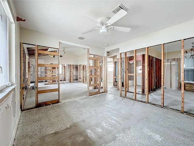 interior space with ceiling fan