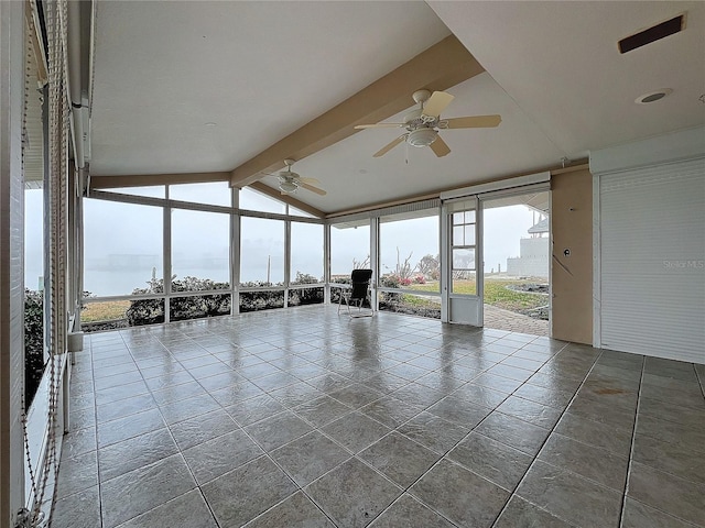 unfurnished sunroom featuring a water view, vaulted ceiling with beams, and ceiling fan